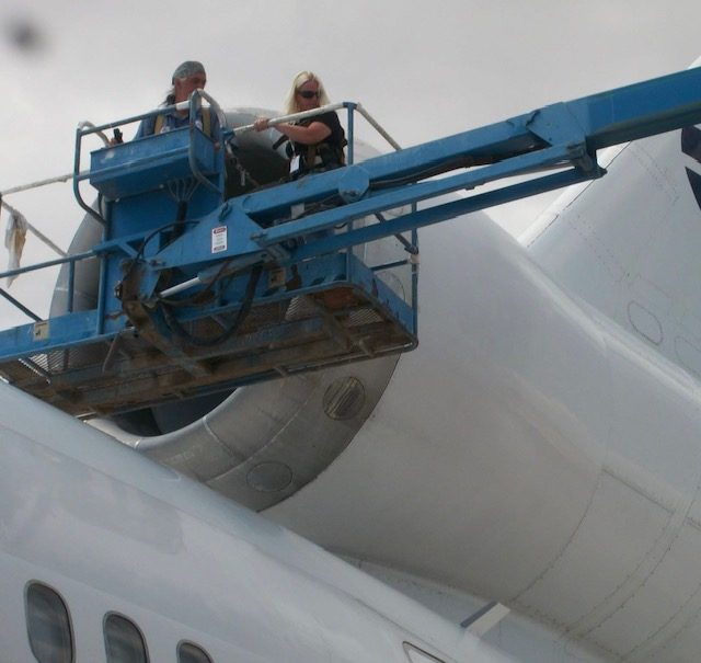 Annie working on aircraft, aviation compliance
